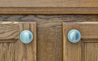 can you paint over stained cabinets
